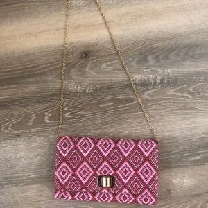 Pink and red clutch with gold chain handle